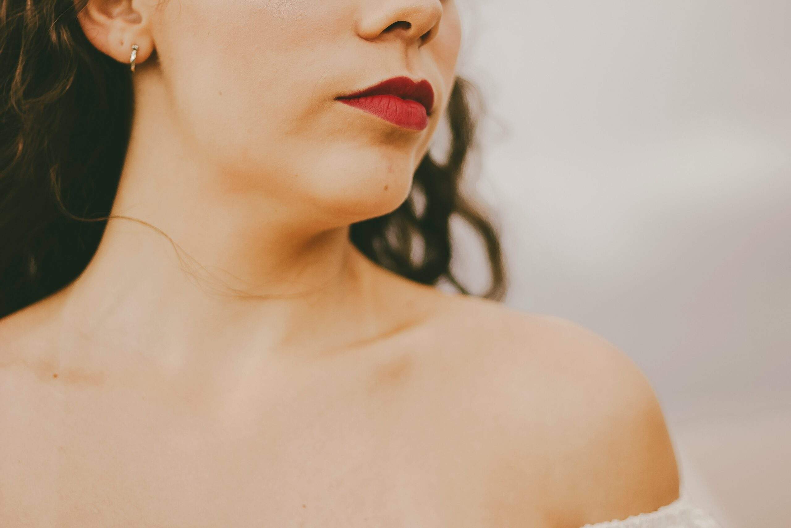 A model sporting a balanced, elegant prom makeup look with subtle shimmer