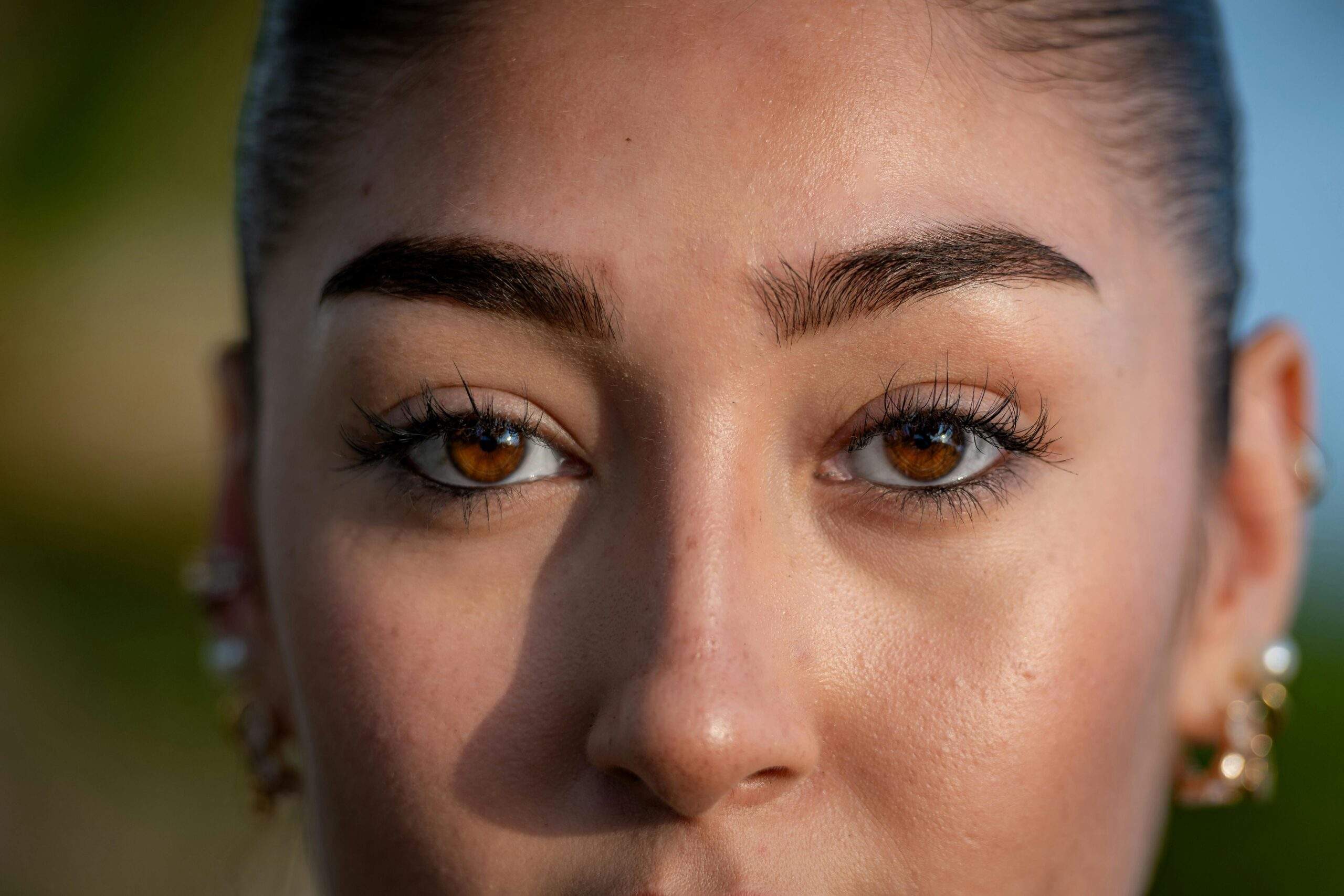 A photo of Jessica T.’s stunning prom look featuring glowing skin and perfectly balanced features achieved through simple yet effective techniques.