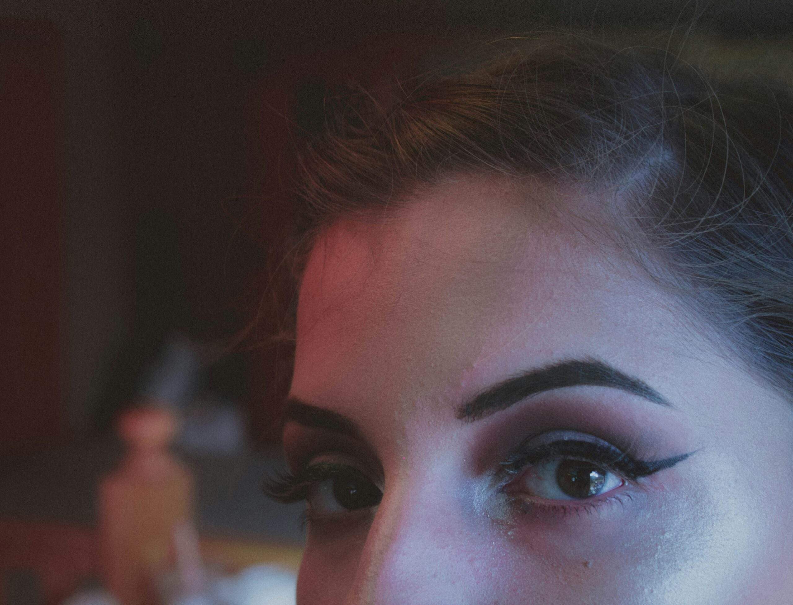 Blush and highlighter applied for a natural rosy glow on cheeks.