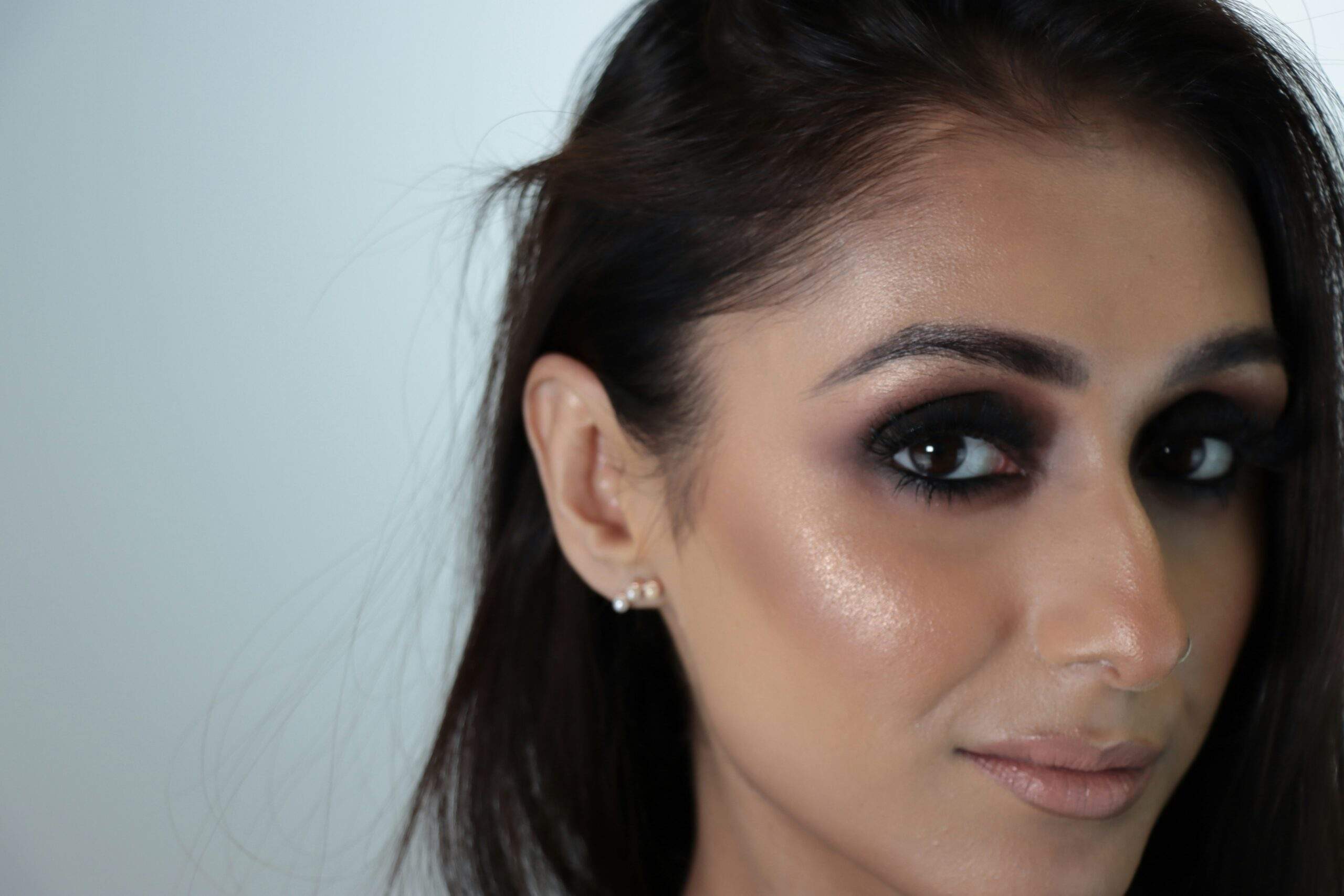 Celebrity wearing minimal makeup highlighting natural features