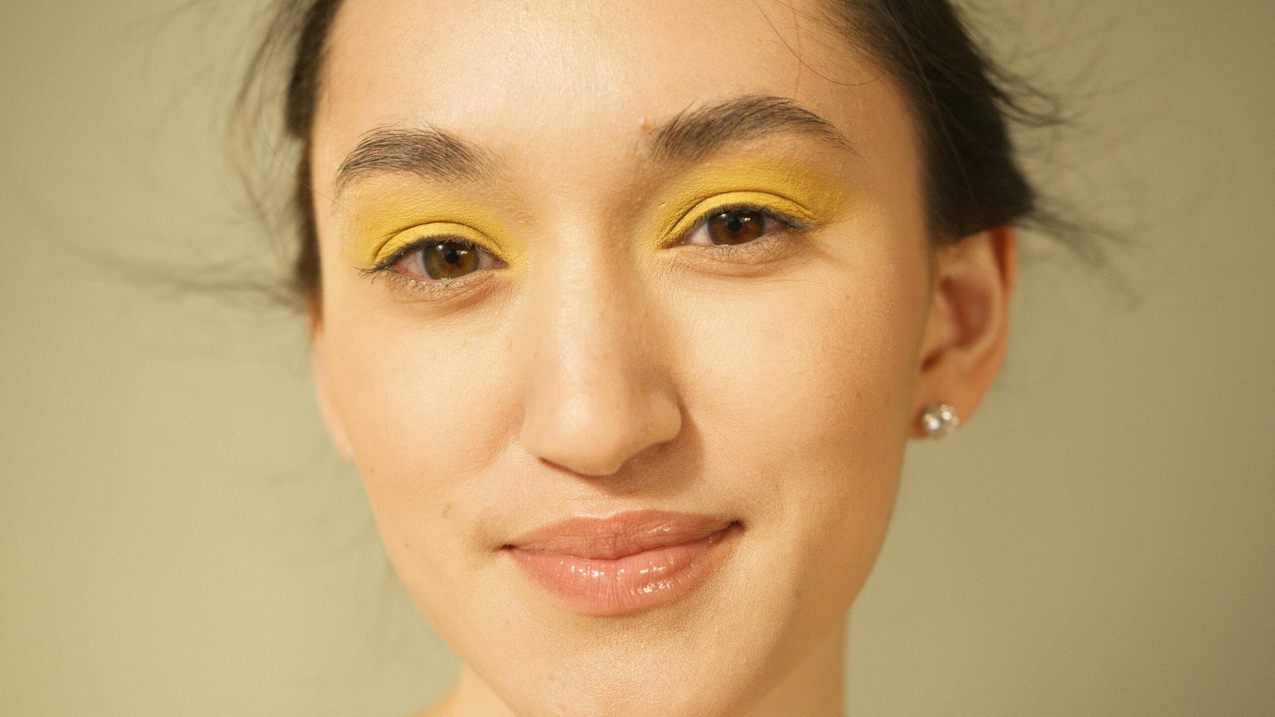 Photo showcasing a glowing prom makeup look with emphasis on youthful radiance