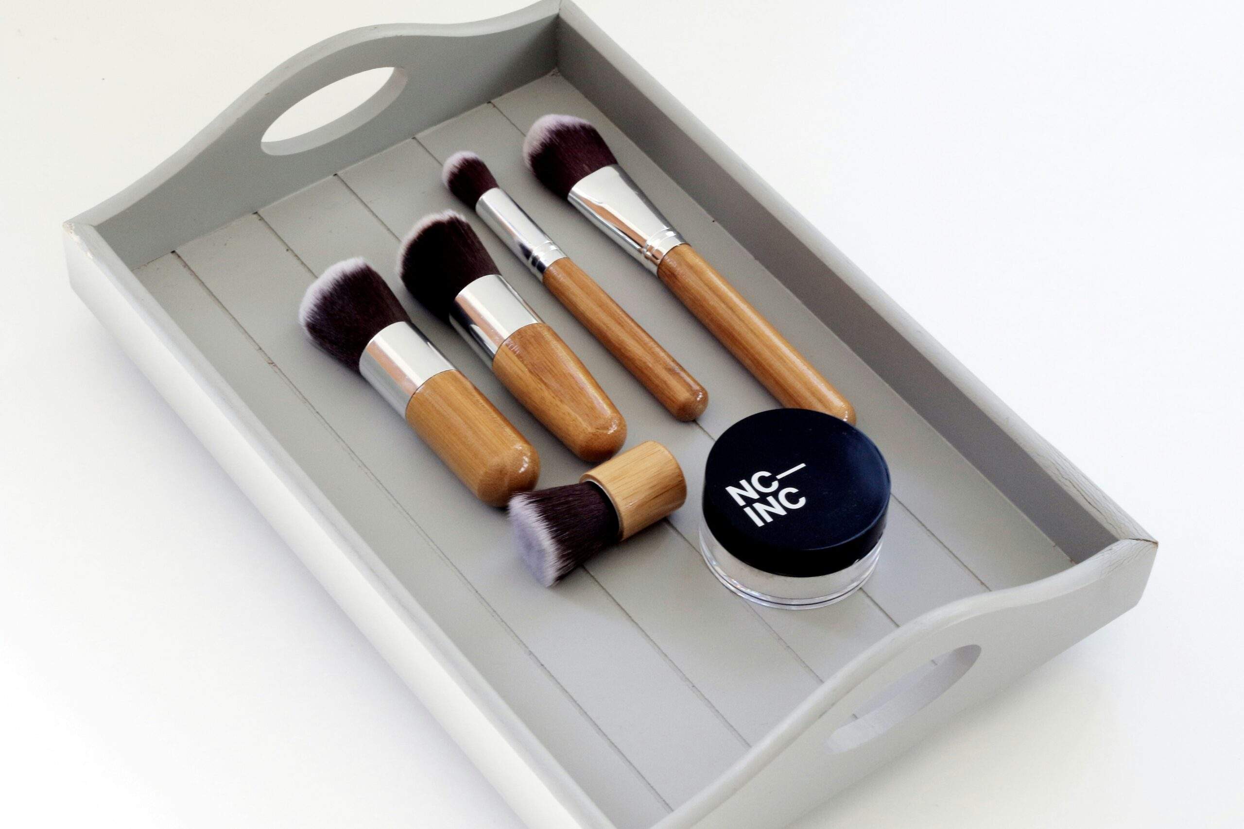 Photo of compact makeup kit with essentials labeled